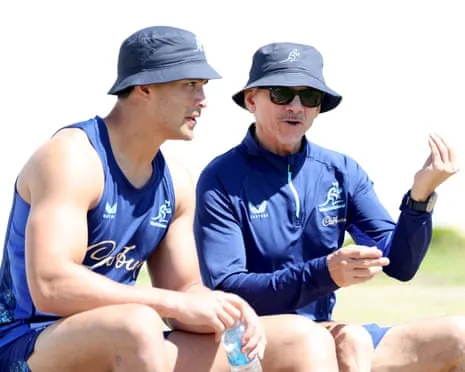 Wallabies head coach Les Kiss speaks with Joseph-Aukuso Suaalii at training before Australia face Japan in a Nations Championship rugby international